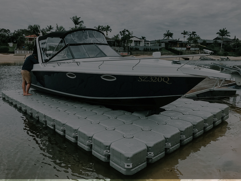 Boat sitting out of the water on a Custom Dry Dock